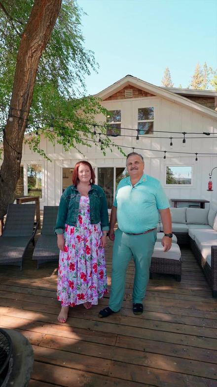 Vertical video still of a couple on a back deck.