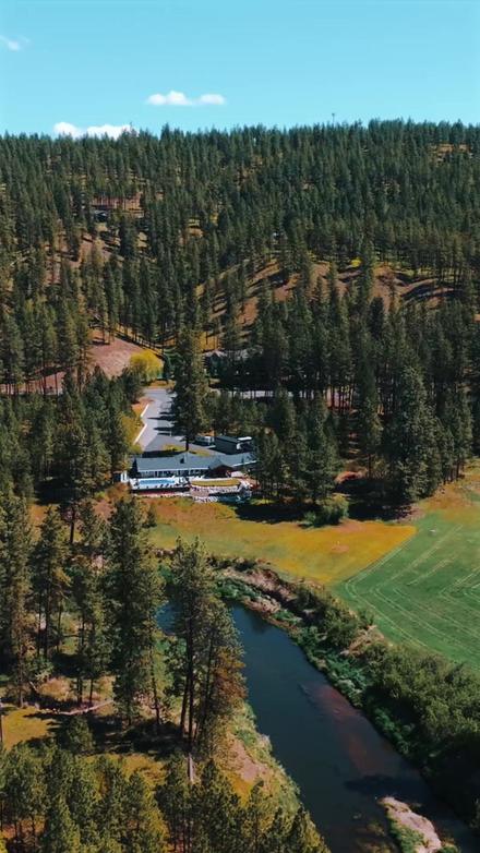 Vertical video still of an aerial view over a valley.